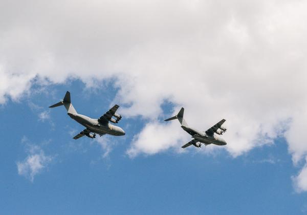 Two planes flying in the sky