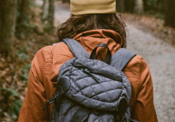person walking in the woods