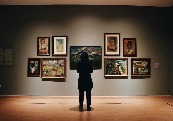 A person standing in an art Gallery