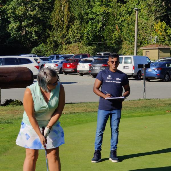 Tony Prem overseeing a hole in one contest at the Chamber of Commerce Golf Tournament