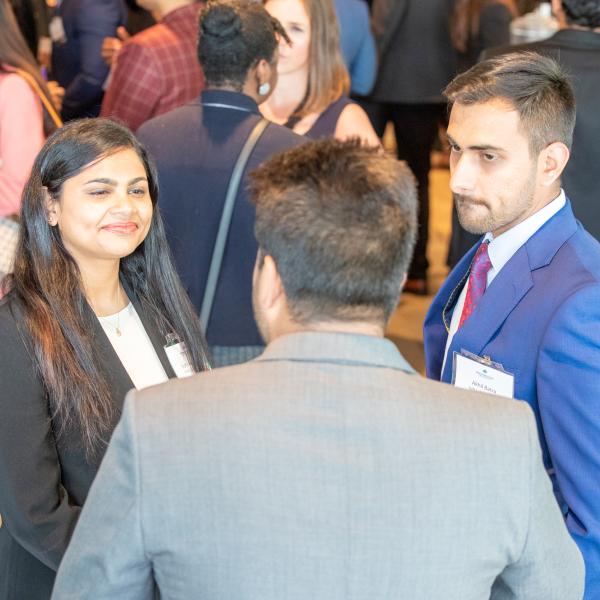 An employer talking to two students at the 2019 FAB 40 event in Vancouver