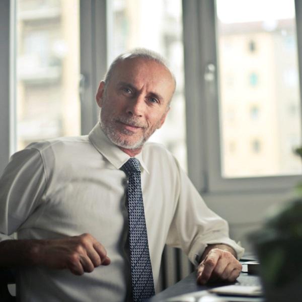 An employer sitting at his desk