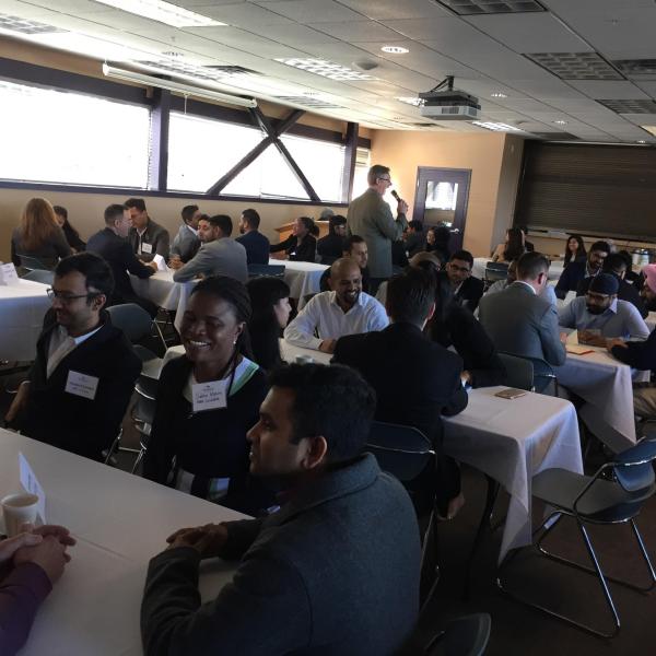 Students and employers sitting at tables during the LMRT