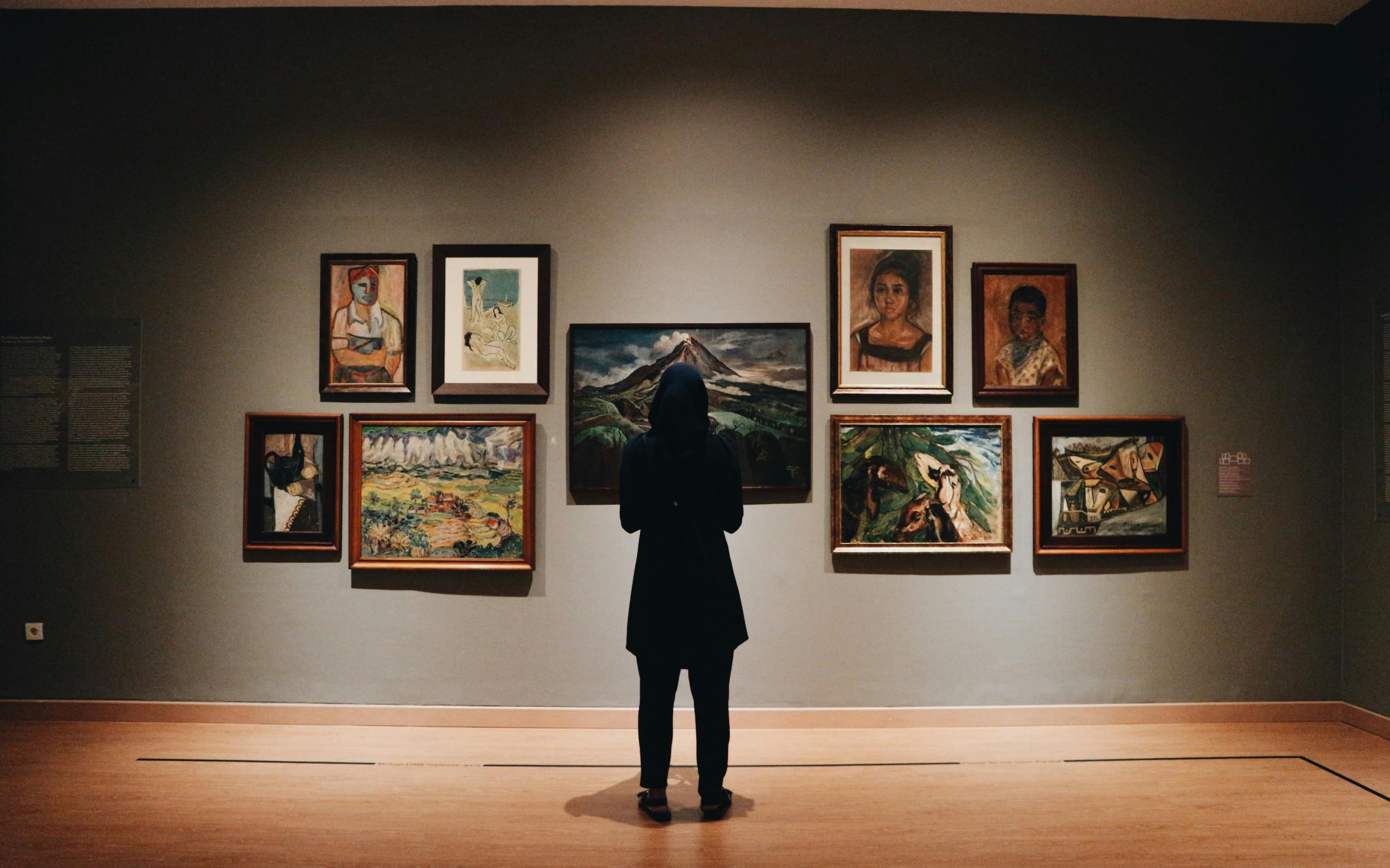 A person standing in an art Gallery