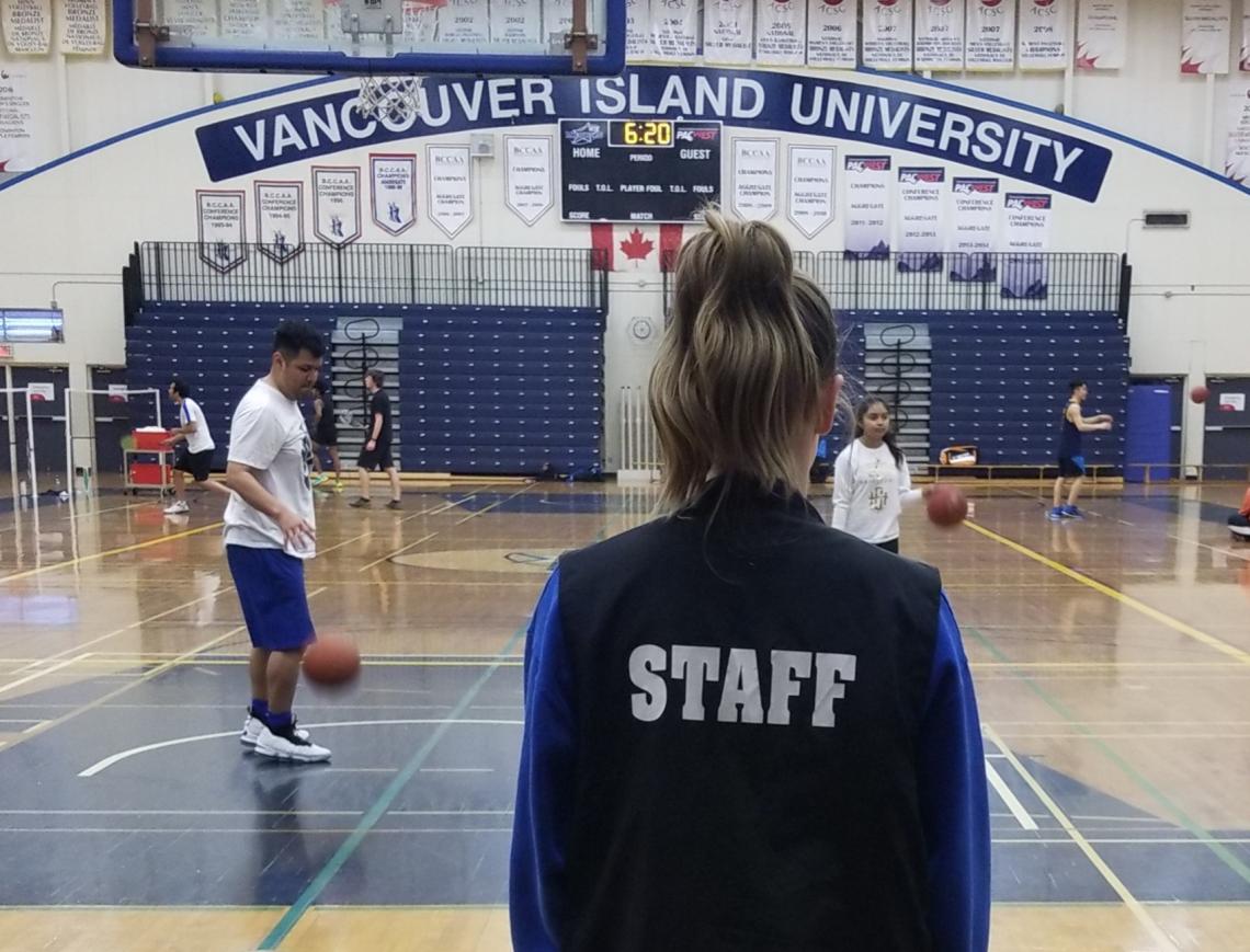VIU Student playing basketball in the gym