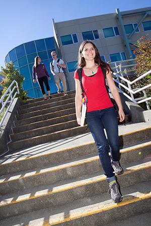 young girl walking down stairs at VIU Nanaimo campus