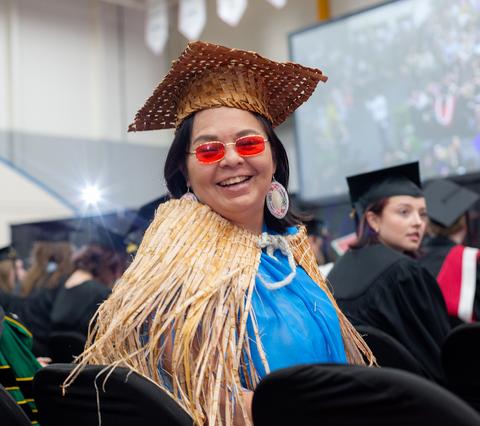 a student wearing traditional regalia at convocation