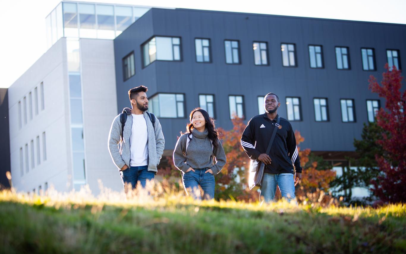 3 students walking outside on VIU Nanaimo Campus