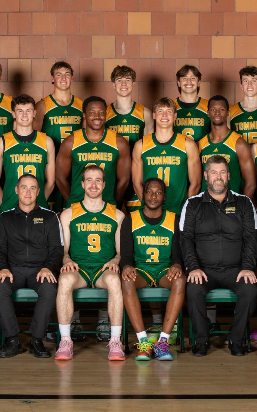 Basketball players in green uniforms