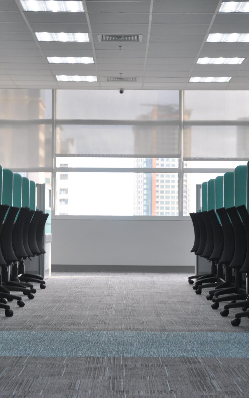 Photo of empty office and cubicles