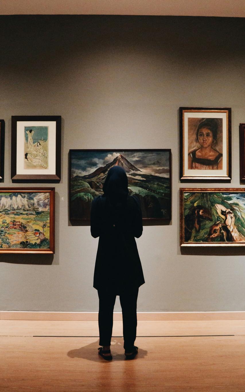 A person standing in an art Gallery
